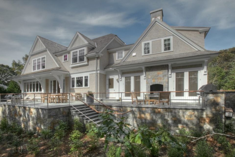 Inspiration for a huge transitional backyard stone and rectangular pool remodel in Boston
