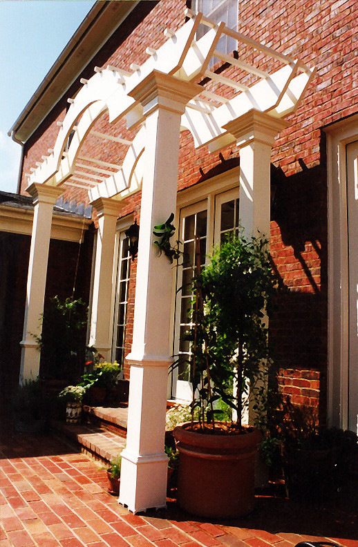 Design ideas for a mid-sized traditional backyard verandah in Atlanta with brick pavers and a pergola.
