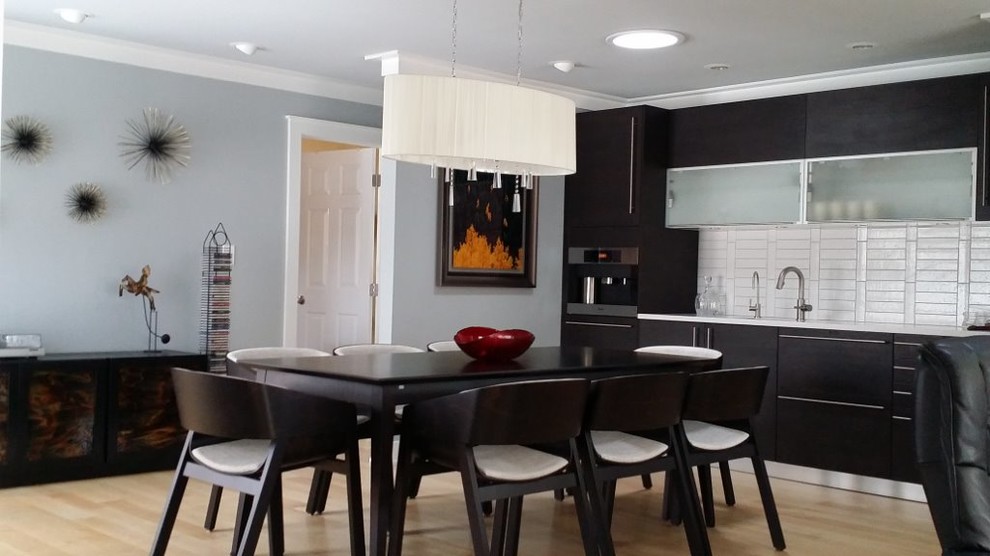 Inspiration for a large modern open plan dining in Charlotte with grey walls and light hardwood floors.