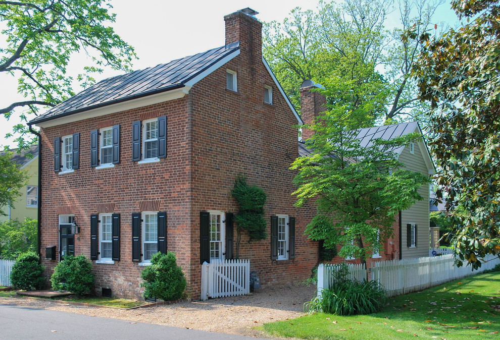 Large traditional two-storey brick exterior in DC Metro with a gable roof.