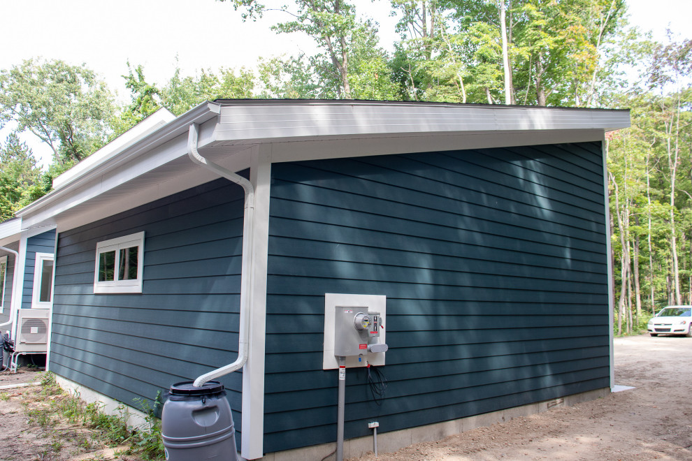 Example of a mid-sized minimalist two-car carport design in Grand Rapids