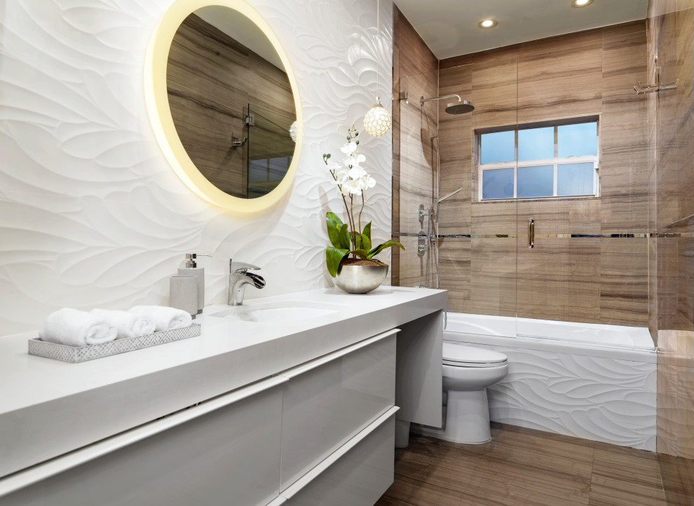 Photo of a small contemporary 3/4 bathroom in Miami with flat-panel cabinets, white cabinets, a corner tub, white tile, glass sheet wall, solid surface benchtops, a hinged shower door, white benchtops, a single vanity and a built-in vanity.