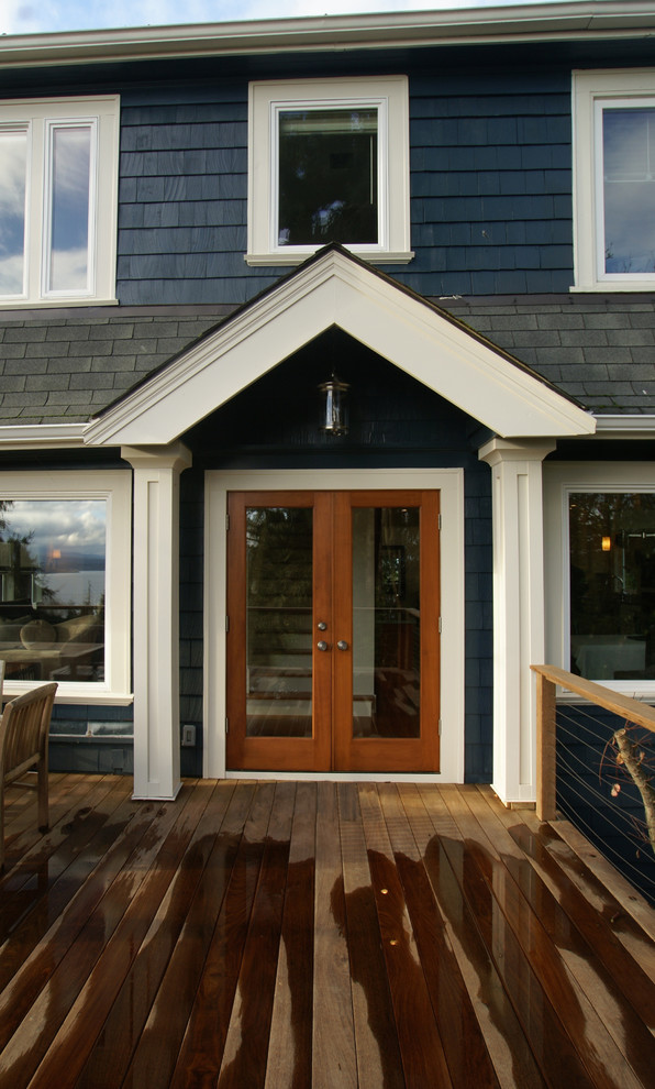Example of a mid-sized transitional backyard deck design in Seattle with no cover