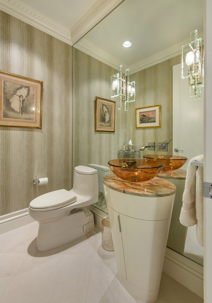 This is an example of a mid-sized contemporary powder room in Other with furniture-like cabinets, white cabinets, a two-piece toilet, beige walls, porcelain floors, a vessel sink, limestone benchtops, white floor and beige benchtops.