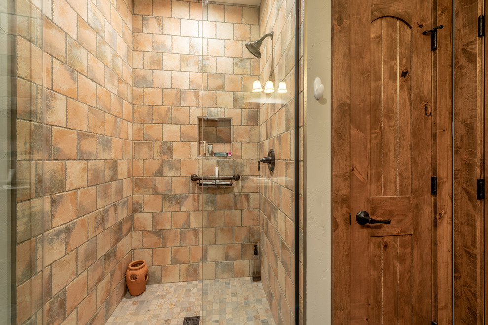 Inspiration for a mid-sized country 3/4 bathroom in Milwaukee with flat-panel cabinets, dark wood cabinets, an alcove shower, a two-piece toilet, multi-coloured tile, terra-cotta tile, grey walls, ceramic floors, an undermount sink, granite benchtops, orange floor, an open shower and grey benchtops.