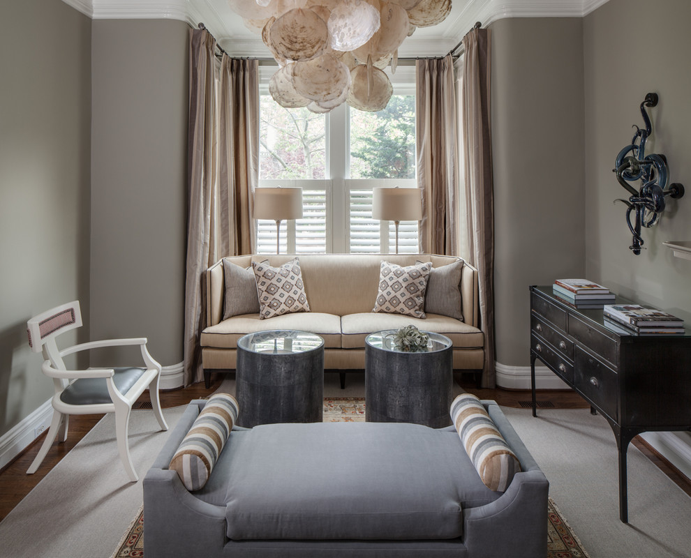 Photo of a mid-sized transitional enclosed family room in DC Metro with grey walls, no fireplace, no tv, medium hardwood floors and brown floor.