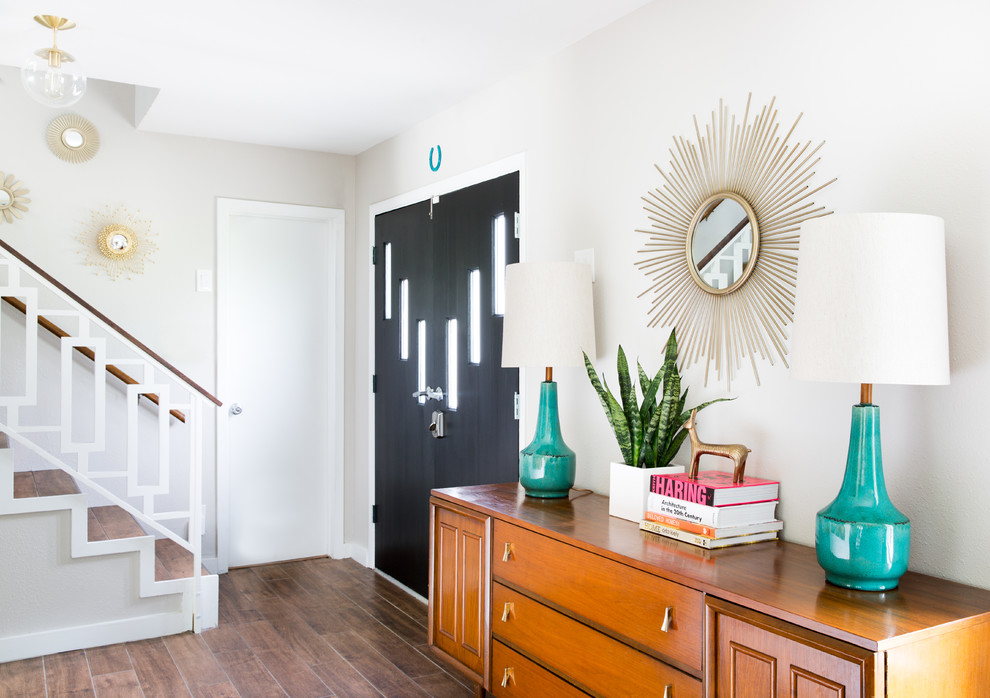 Mid-sized midcentury foyer in Austin with grey walls, ceramic floors, a double front door and a black front door.