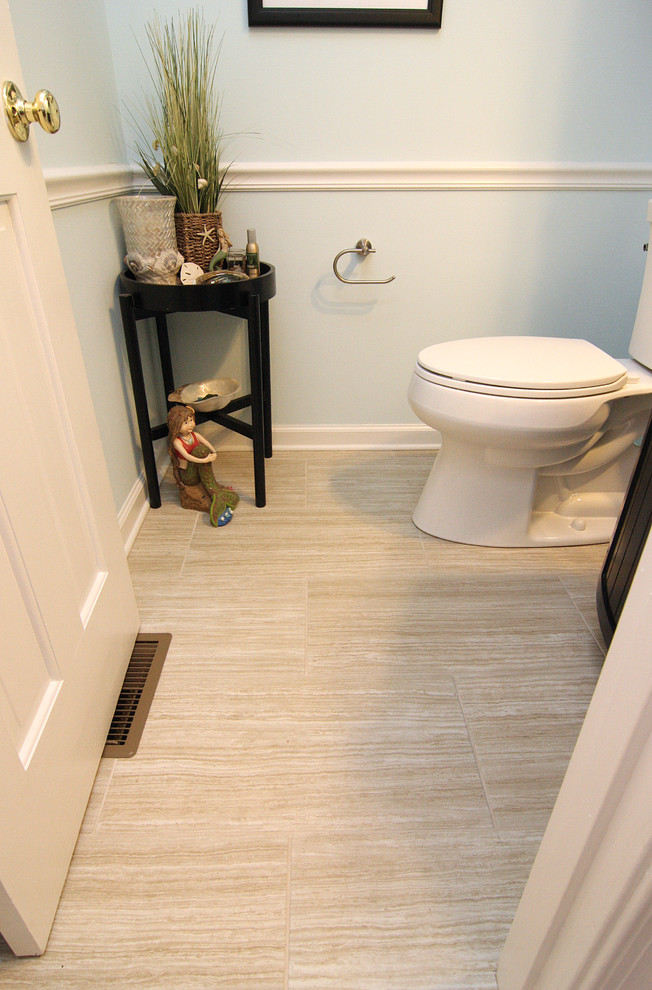 Example of a small beach style gray tile and glass tile porcelain tile bathroom design in Other with a vessel sink, furniture-like cabinets, black cabinets, granite countertops, a two-piece toilet and blue walls