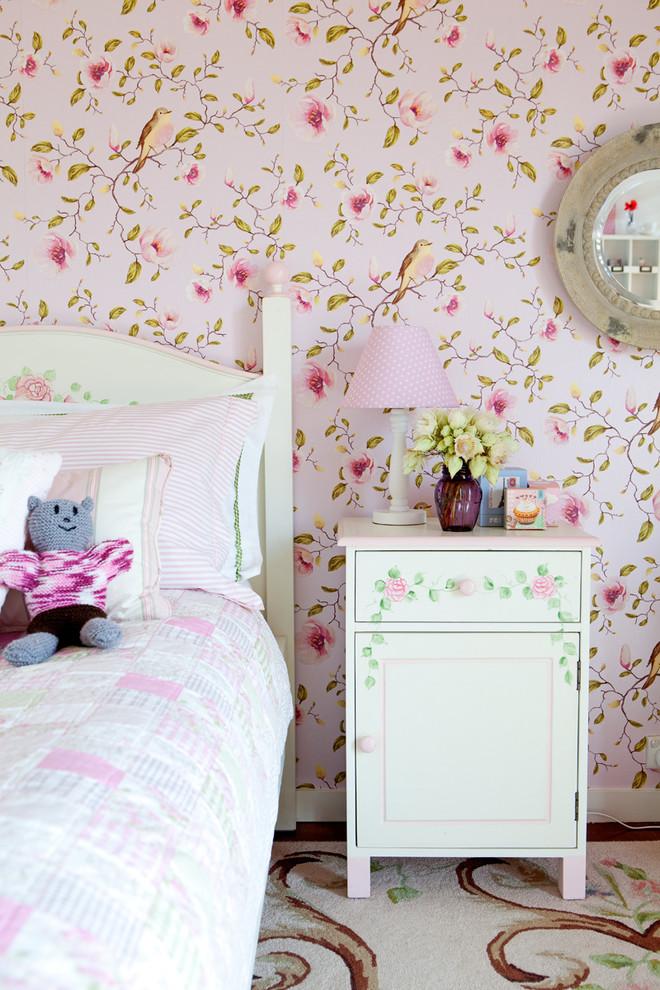 Inspiration for a mid-sized eclectic bedroom in Brisbane with pink walls, medium hardwood floors and brown floor.