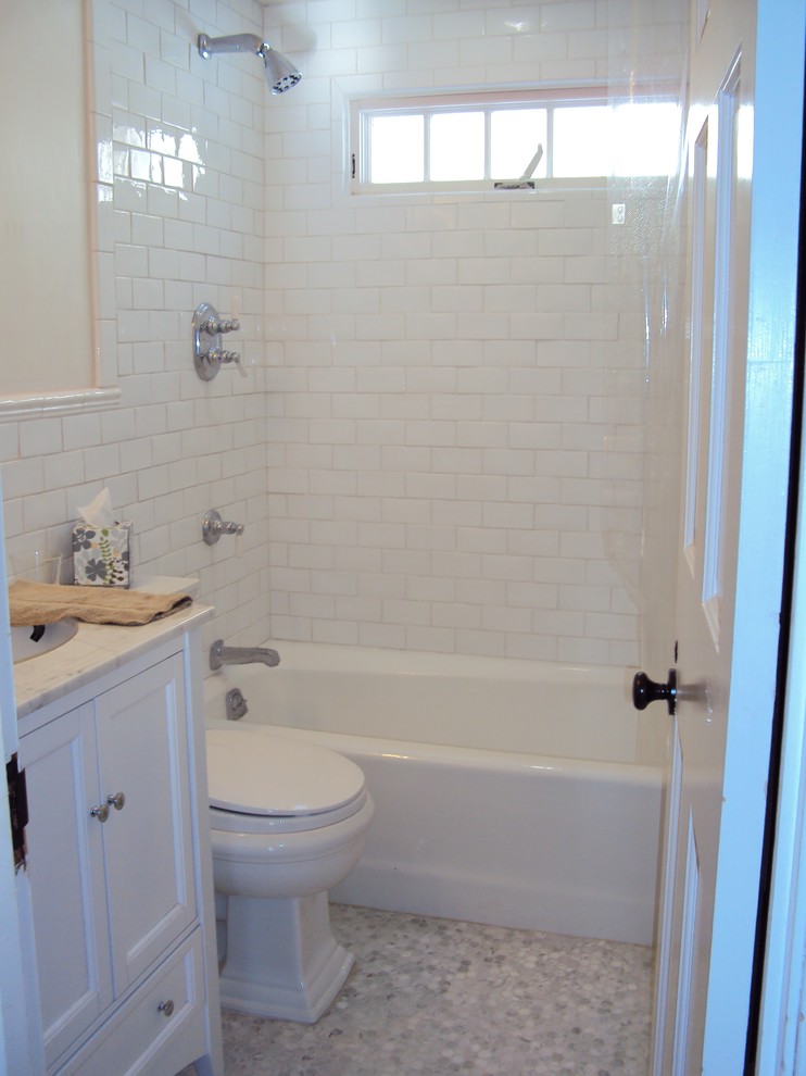 Photo of a small traditional kids bathroom in Boston with furniture-like cabinets, subway tile and marble floors.