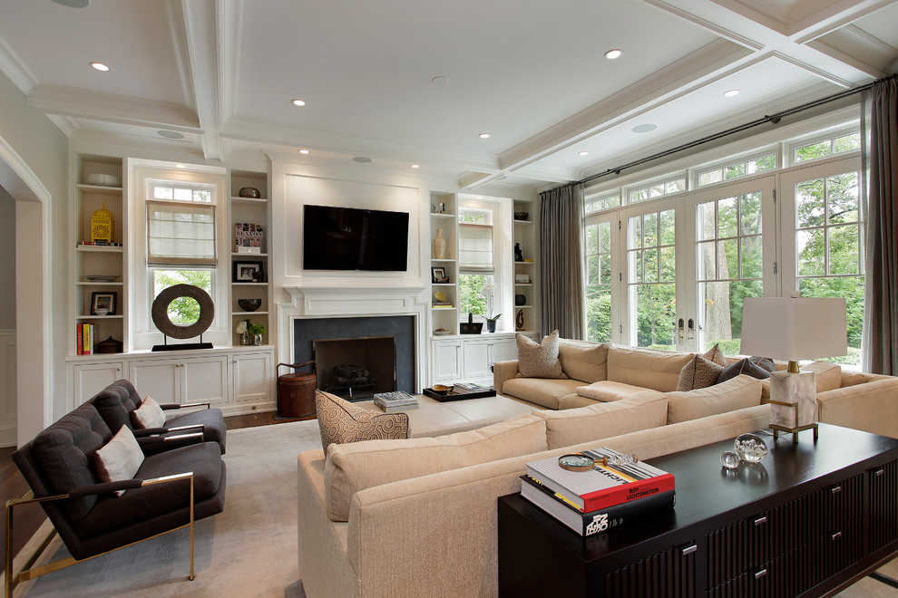 This is an example of a traditional living room in Chicago with a standard fireplace and a wall-mounted tv.