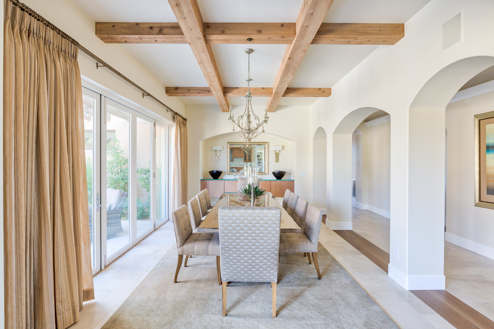 This is an example of a mid-sized contemporary open plan dining in Phoenix with white walls, limestone floors, no fireplace and white floor.