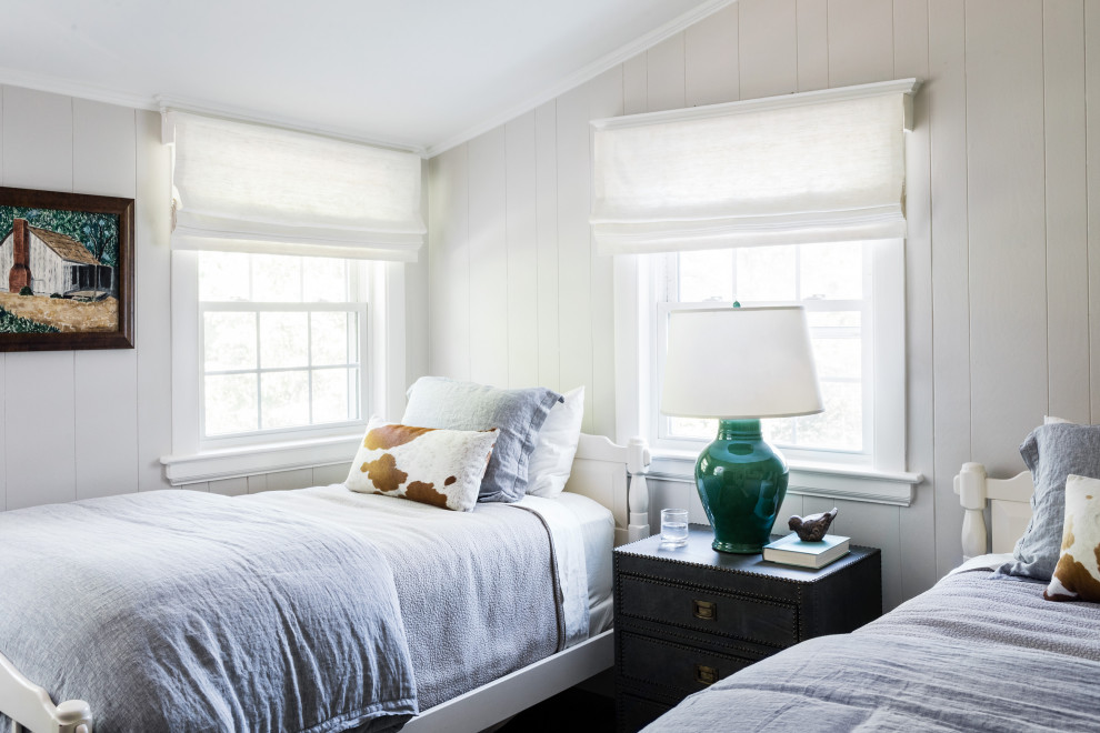 This is an example of a transitional gender-neutral kids' room in Boston with white walls.