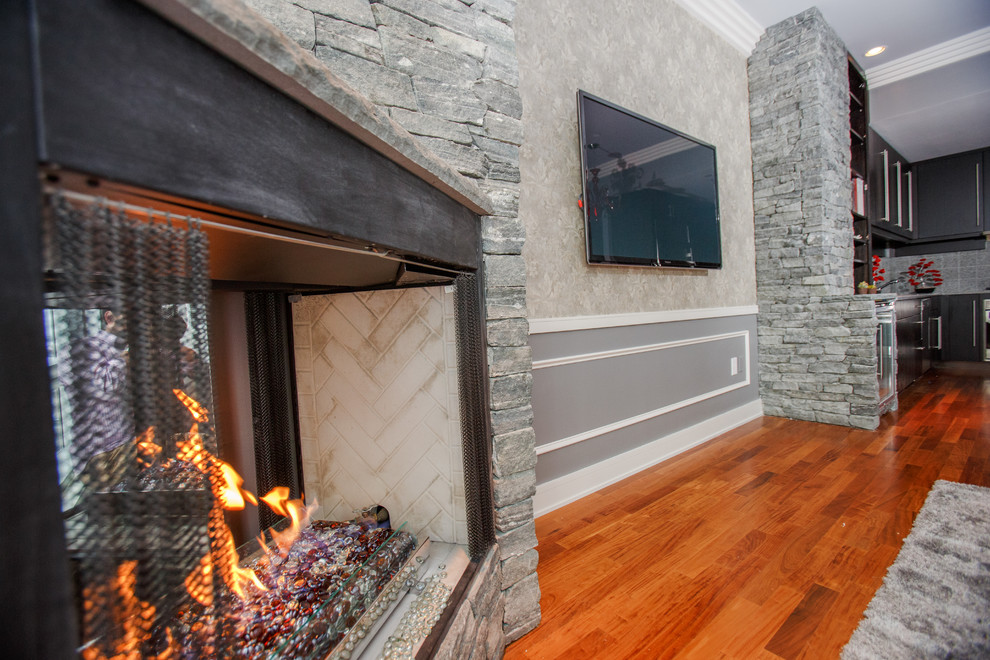 Small contemporary formal open concept living room in Boston with grey walls, medium hardwood floors, a corner fireplace, a stone fireplace surround and a wall-mounted tv.