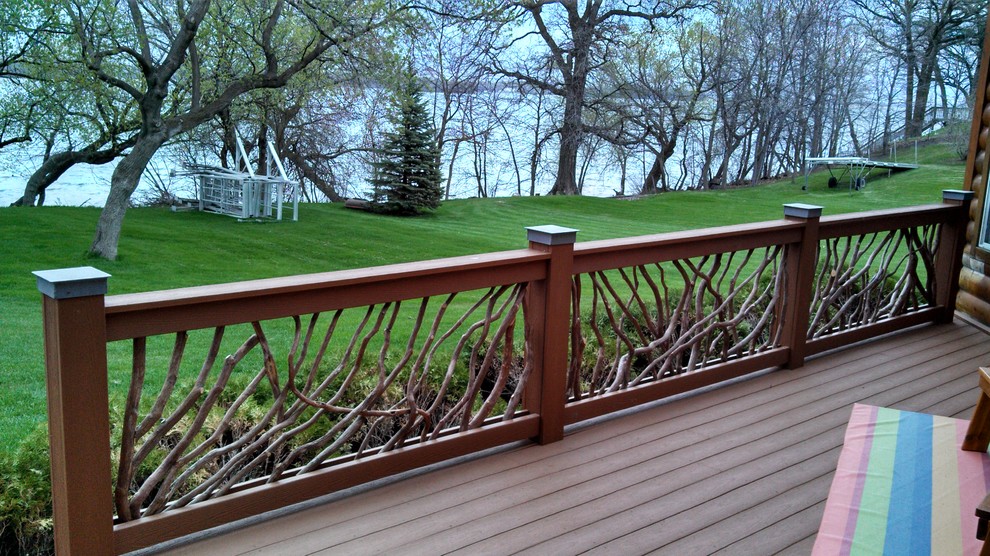 Mid-sized mountain style backyard home design photo