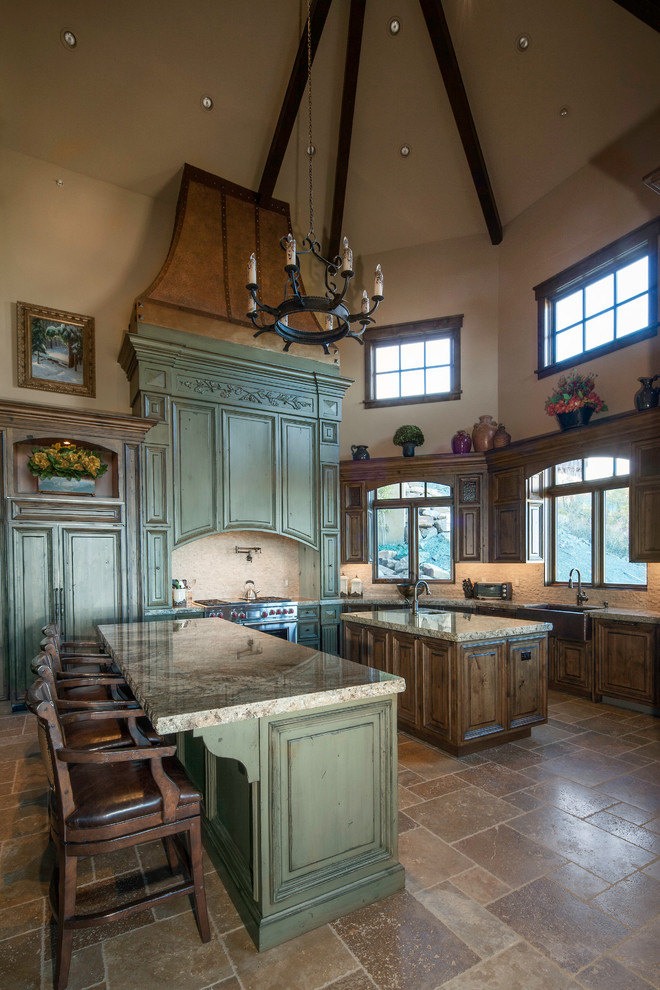 Inspiration for an expansive country galley open plan kitchen in Salt Lake City with a farmhouse sink, recessed-panel cabinets, green cabinets, granite benchtops, white splashback, mosaic tile splashback, panelled appliances, ceramic floors and multiple islands.