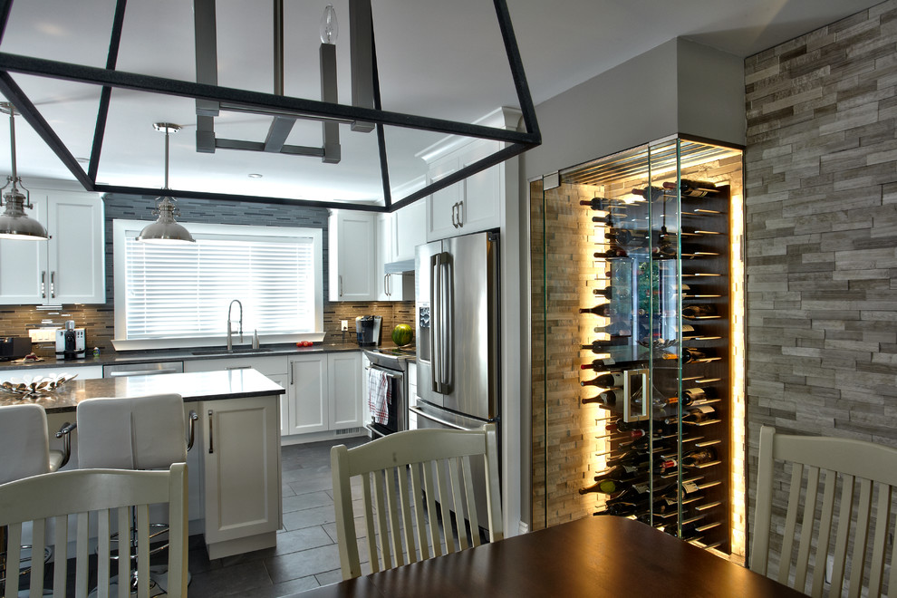 Small modern wine cellar in Montreal with ceramic floors and display racks.