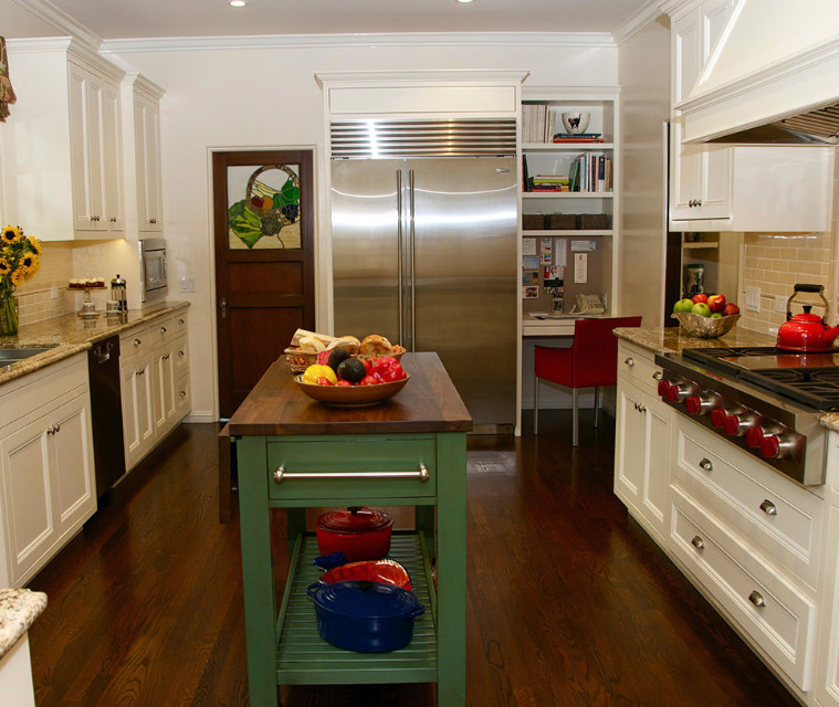 Photo of a mid-sized transitional u-shaped separate kitchen in Los Angeles with an undermount sink, recessed-panel cabinets, white cabinets, granite benchtops, beige splashback, glass tile splashback, stainless steel appliances, dark hardwood floors, with island, brown floor and multi-coloured benchtop.