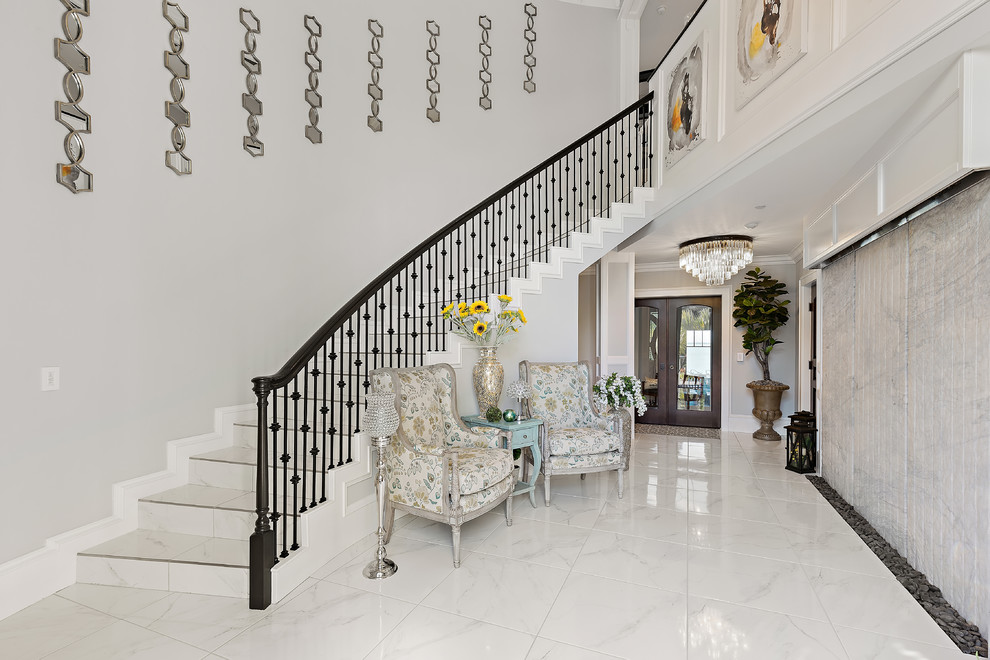 This is an example of a beach style tile curved staircase in Tampa with tile risers.