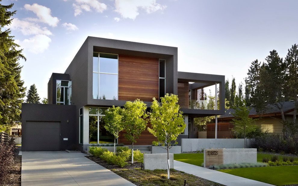 This is an example of a modern exterior in Edmonton with wood siding.