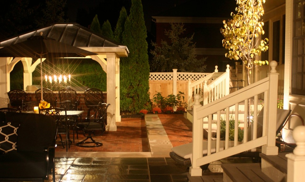 Patio - large transitional backyard concrete paver patio idea in Columbus with a pergola