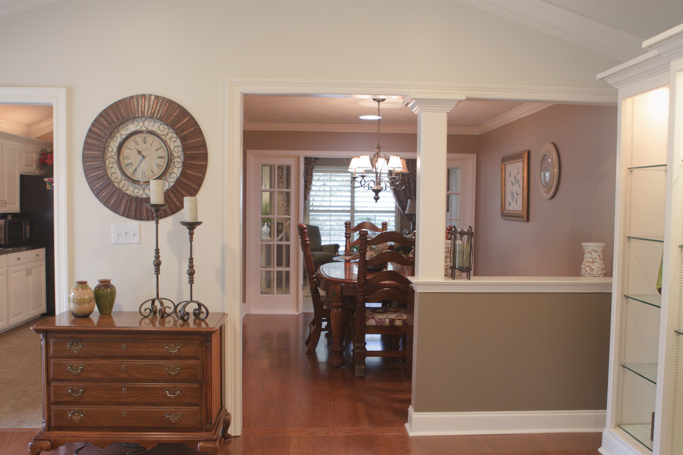 Photo of a mid-sized traditional kitchen/dining combo in Jackson with beige walls, medium hardwood floors and no fireplace.