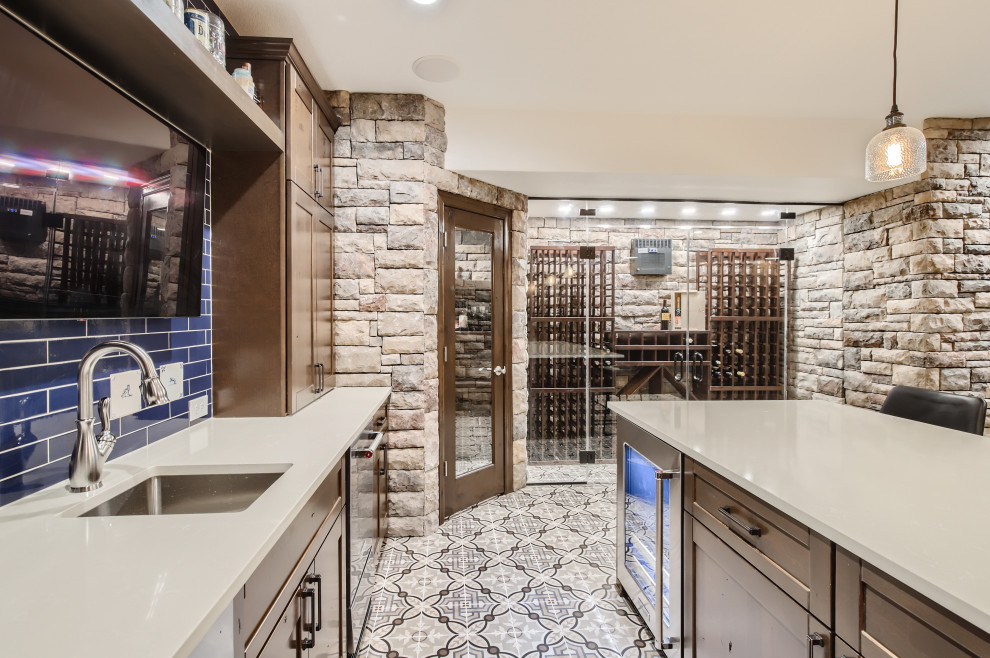 This is an example of a small mediterranean basement in Denver with ceramic floors and decorative wall panelling.