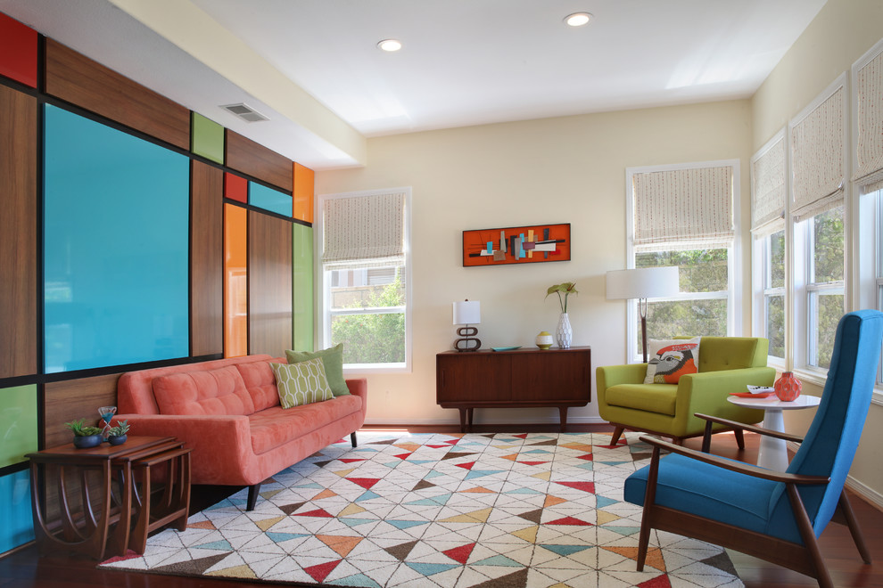 This is an example of a mid-sized midcentury living room in Orange County with multi-coloured walls and medium hardwood floors.