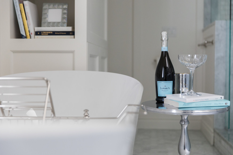 Example of a large transitional marble floor and white floor bathroom design in Calgary with white walls