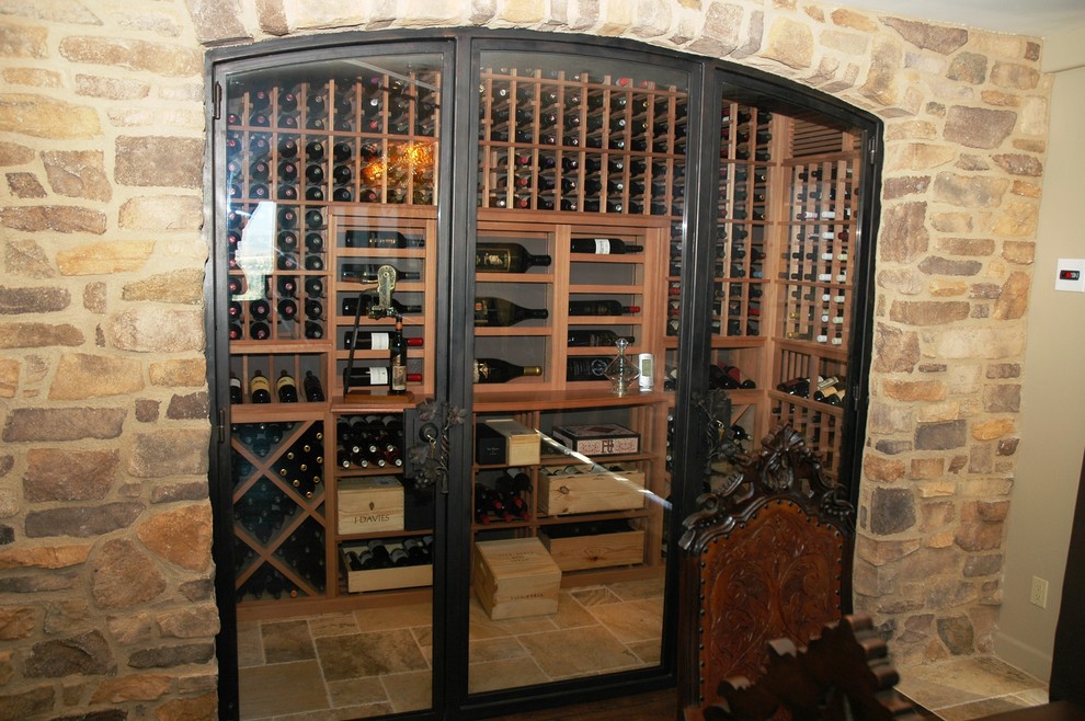 Inspiration for a small contemporary wine cellar in San Diego with terra-cotta floors and display racks.