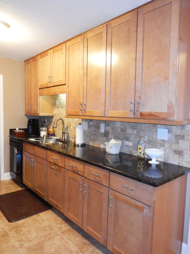 Inspiration for a small transitional galley porcelain tile eat-in kitchen remodel with an undermount sink, shaker cabinets, light wood cabinets, laminate countertops, multicolored backsplash, stainless steel appliances, beige walls and no island