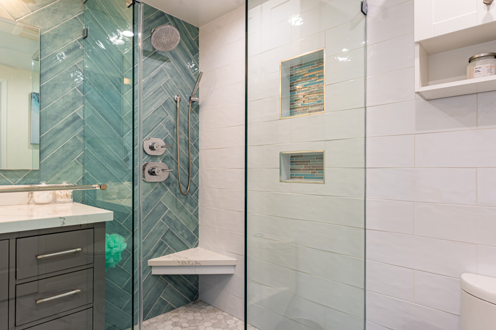 Medium sized nautical shower room bathroom in Los Angeles with shaker cabinets, grey cabinets, a corner shower, a one-piece toilet, metro tiles, white walls, marble flooring, a submerged sink, engineered stone worktops, white floors, a hinged door, white worktops, a wall niche, a single sink, a freestanding vanity unit, white tiles, a wallpapered ceiling and wallpapered walls.