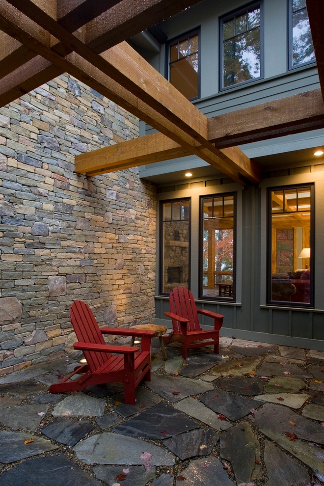 Photo of a contemporary patio in Other with a pergola.