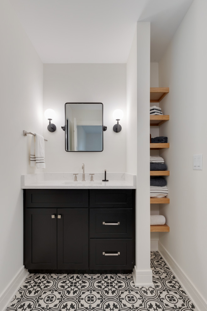 Inspiration for a bathroom in Milwaukee with shaker cabinets, blue cabinets, white walls, porcelain floors, an undermount sink, engineered quartz benchtops, multi-coloured floor, white benchtops, a single vanity and a built-in vanity.