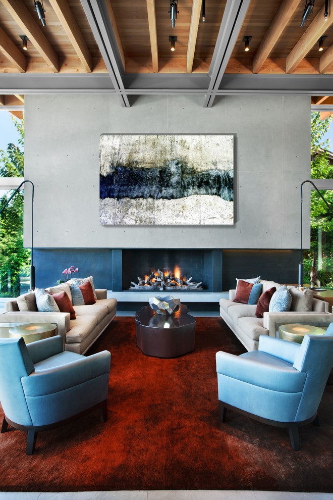 Inspiration for a contemporary formal open concept living room in Seattle with grey walls, porcelain floors, a standard fireplace, a concrete fireplace surround and grey floor.