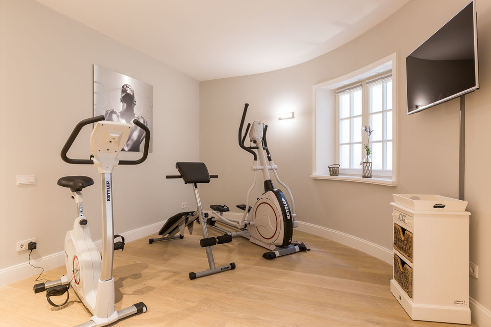 Inspiration for a small country multipurpose gym in Other with beige walls, light hardwood floors and beige floor.