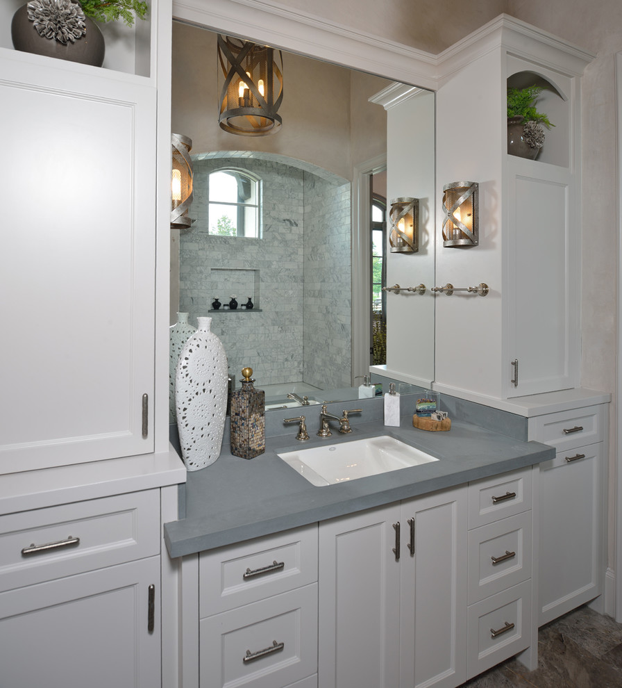 Large eclectic master bathroom in Houston with recessed-panel cabinets, white cabinets, an alcove tub, an alcove shower, white tile, ceramic tile, white walls, ceramic floors, an undermount sink, engineered quartz benchtops, beige floor and a shower curtain.