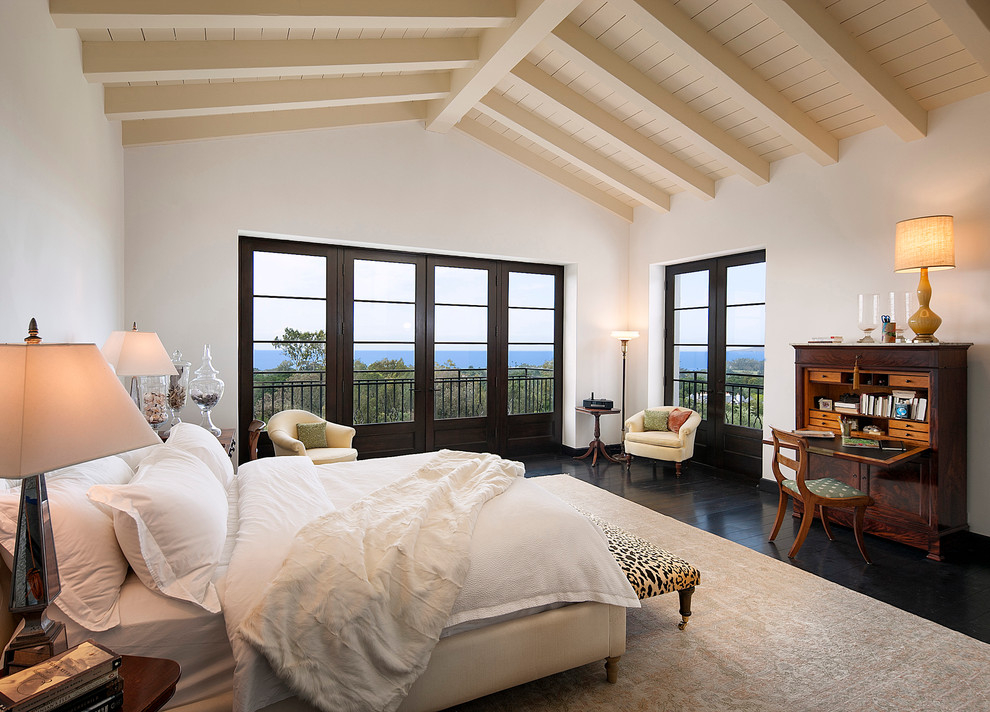 Design ideas for a large mediterranean master bedroom in Other with white walls, dark hardwood floors and no fireplace.
