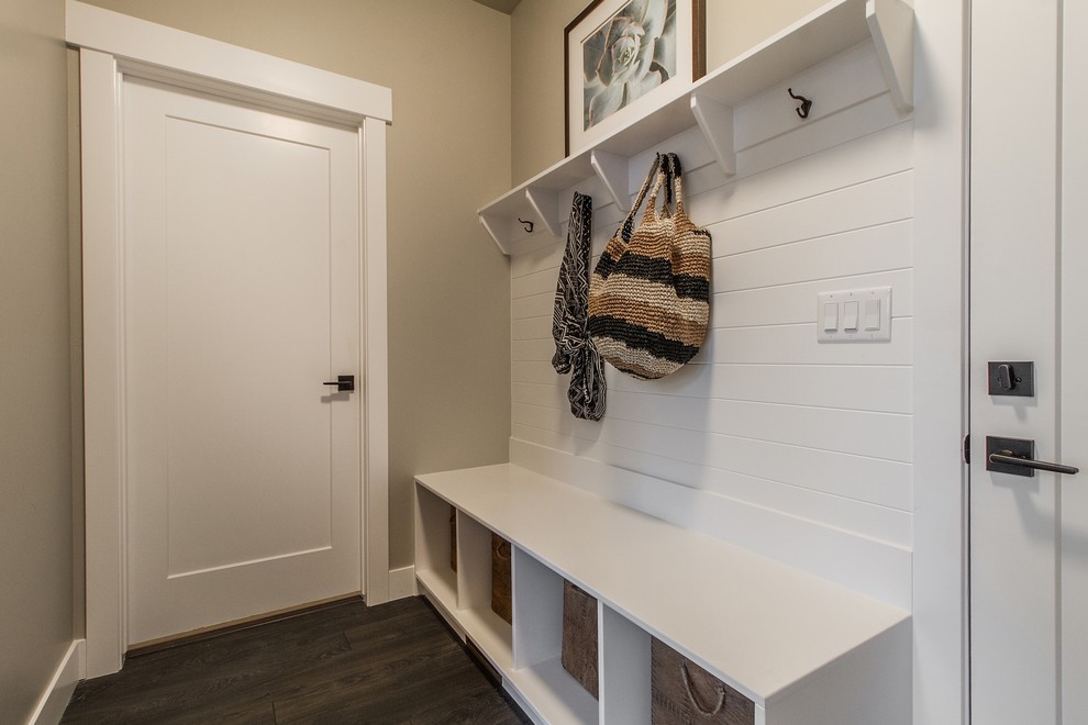 Design ideas for a traditional mudroom in Salt Lake City with beige walls, dark hardwood floors, a single front door and a white front door.