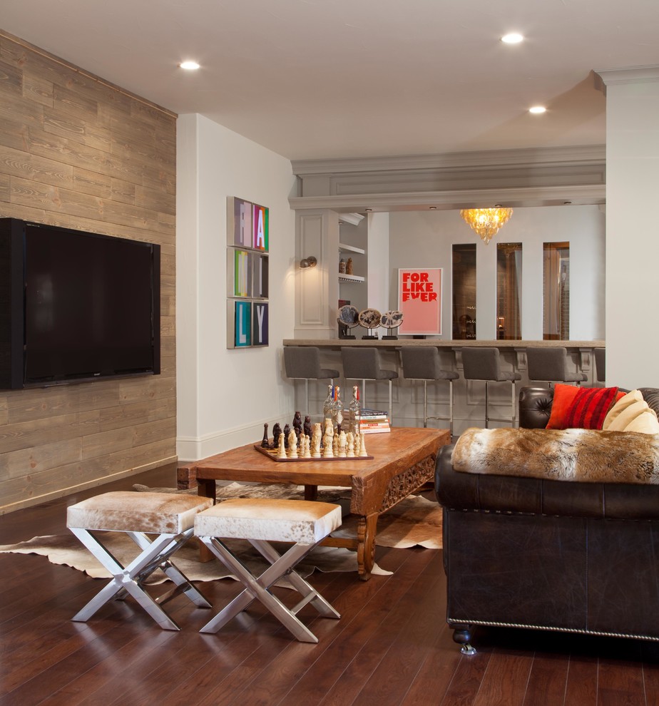 Example of a transitional enclosed family room design in Denver