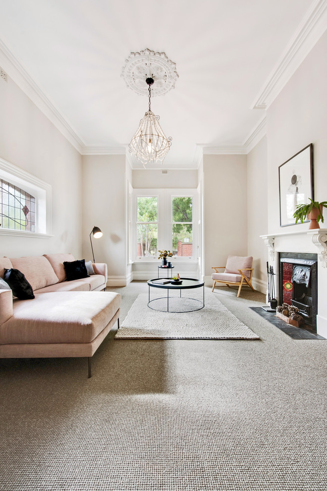 This is an example of a scandinavian formal enclosed living room in Adelaide with beige walls, carpet, a standard fireplace and grey floor.