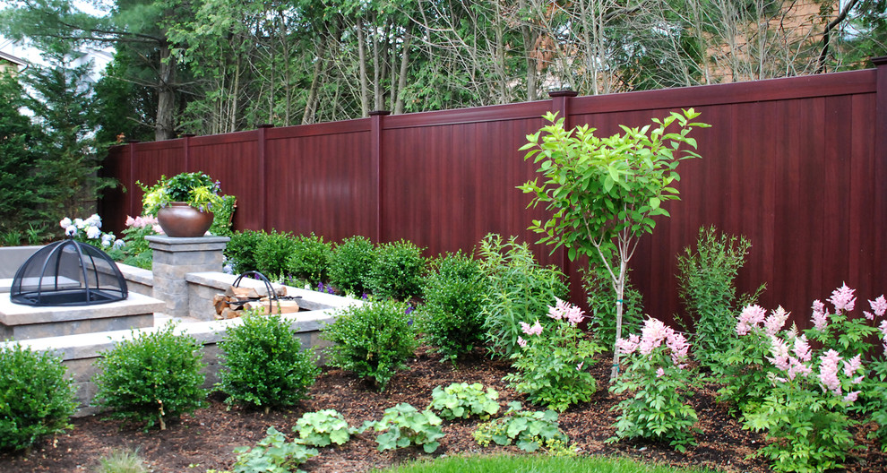 Photo of a traditional garden in New York with a vinyl fence.