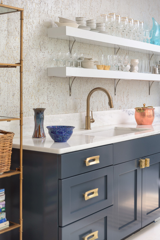 Design ideas for an expansive transitional galley open plan kitchen in Other with an undermount sink, shaker cabinets, blue cabinets, soapstone benchtops, white splashback, white appliances, painted wood floors, with island, white floor and black benchtop.