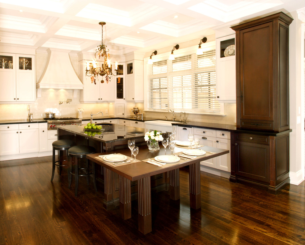Photo of a transitional eat-in kitchen in Toronto with recessed-panel cabinets, white cabinets and white splashback.