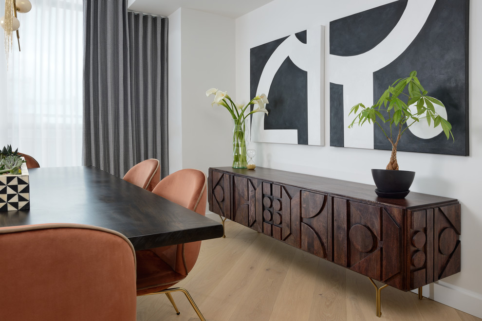 Mid-sized transitional light wood floor dining room photo in Toronto with white walls