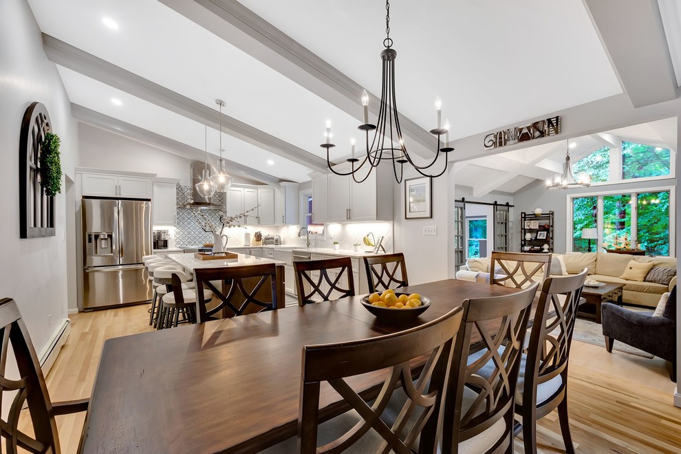 Inspiration for a transitional light wood floor eat-in kitchen remodel in Boston with an island