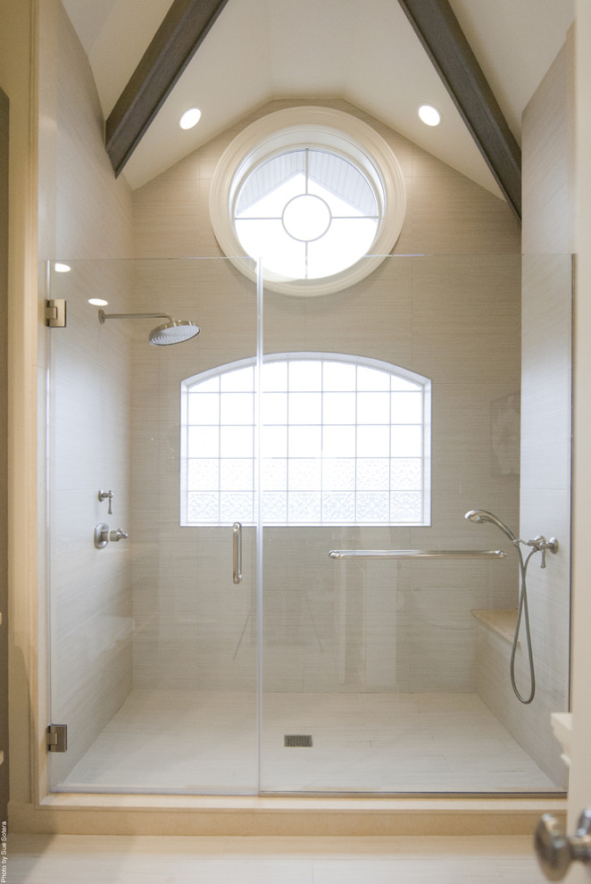 Photo of a contemporary bathroom in New York with an alcove shower and beige tile.