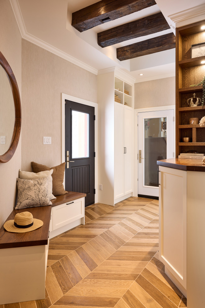 Mudroom - mid-sized transitional porcelain tile, brown floor, tray ceiling and wallpaper mudroom idea in Ottawa with multicolored walls and a black front door