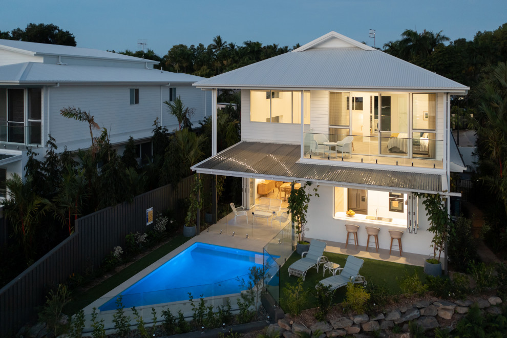 Contemporary two-storey white exterior in Other.