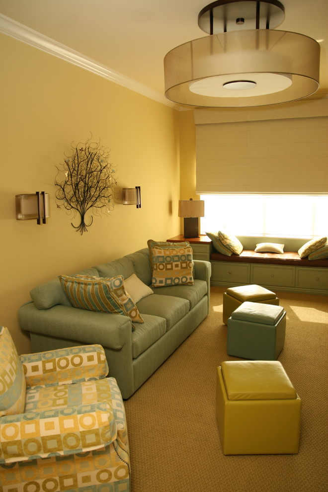 Photo of a mid-sized contemporary enclosed home theatre in Tampa with yellow walls, carpet and a built-in media wall.
